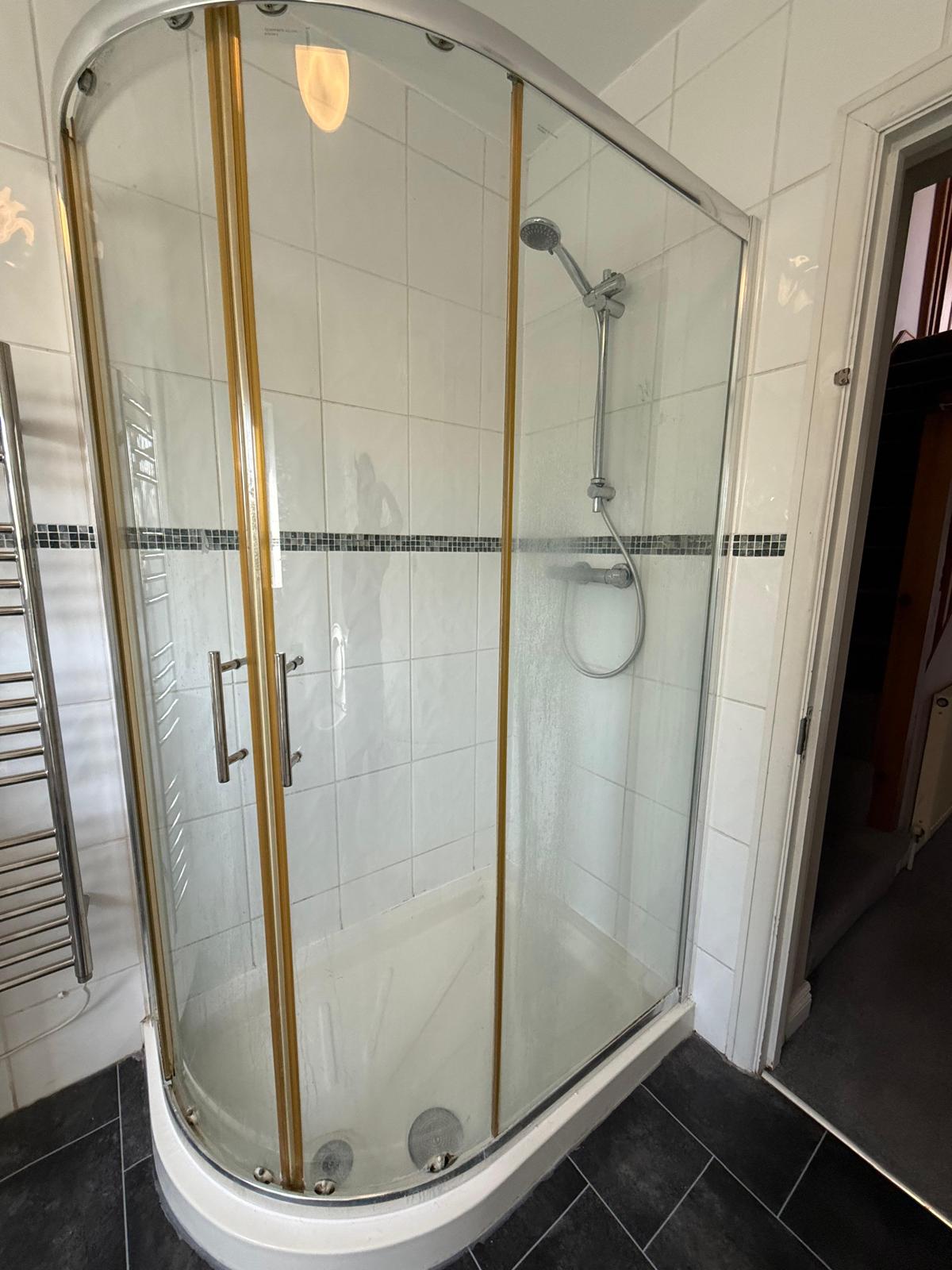 Toilet, basin and surrounding tiling cleaned and sanitised